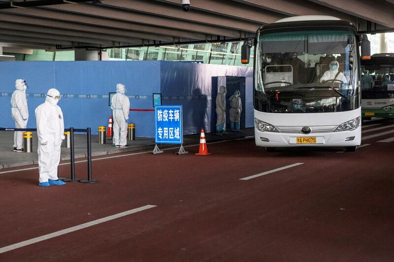 A bus carrying members of the WHO team tasked with investigating the origins of the pandemic leaves Wuhan Tianhe International Airport in Wuhan, Hubei province, China. Reuters