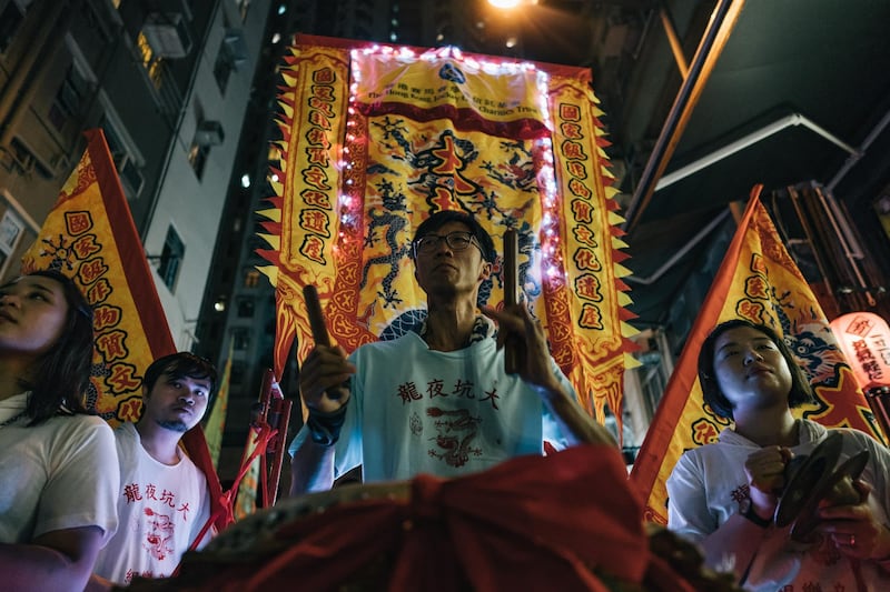 Members of the fire dragon dance team perform the Fire Dragon Dance to celebrate the Mid-Autumn Festival.