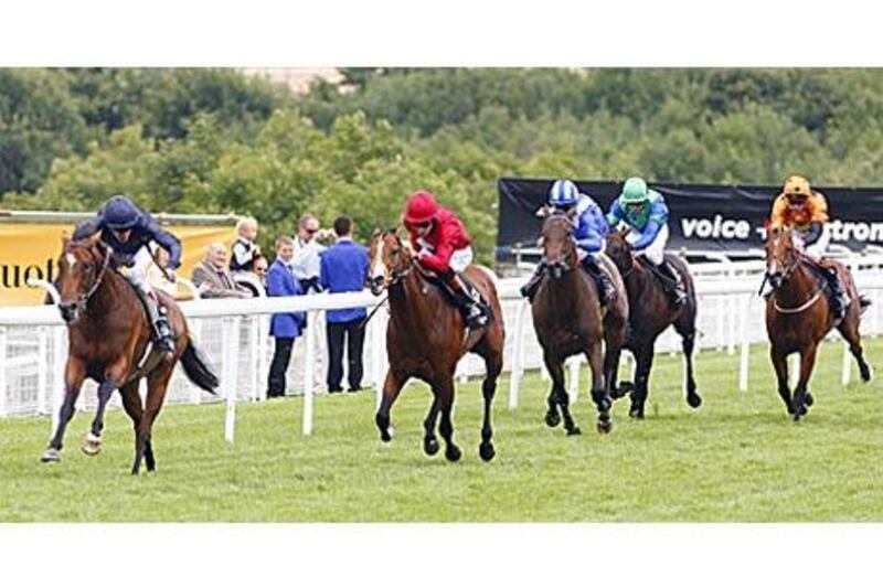 Rip Van Winkle and Johnny Murtagh win The BGC Sussex Stakes from Paco Boy (red) and Ghanaati (blue) at Goodwood.