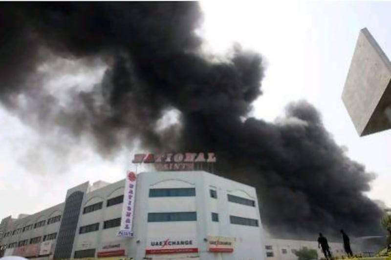 Smoke billows from the National Paints factory in Sharjah. Fire inspectors in the emirate are to ensure safety regulations are being followed before the summer months.