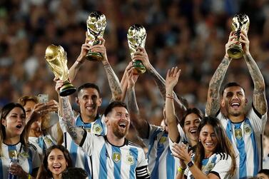 FILE PHOTO: Soccer Football - International Friendly - Argentina v Panama - Estadio Monumental, Buenos Aires, Argentina - March 23, 2023 Argentina's Lionel Messi and team mates celebrate with their families and World Cup trophies after the match REUTERS / Agustin Marcarian / File Photo