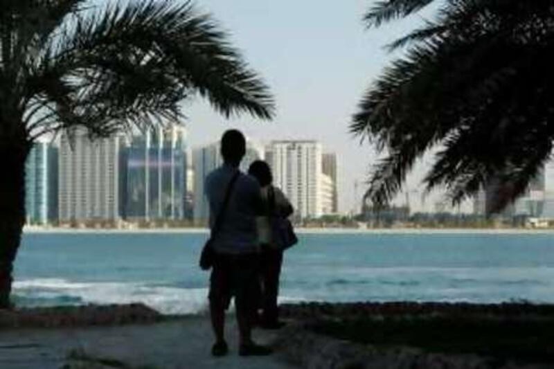 ABU DHABI, UNITED ARAB EMIRATES - November 12, 2008: Tourist explore Heritage Village in Abu Dhabi. 
( Ryan Carter / The National ) *** Local Caption ***  RC006-Tourism.JPG