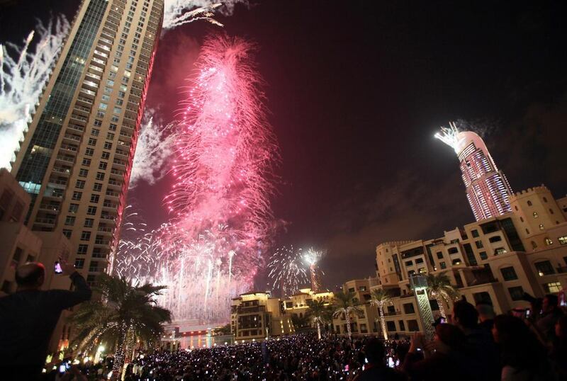 Fireworks illuminate Burj Khalifa as thousands of people gather to celebrate the New Year in Dubai on January 1, 2013. STR / AFP photo