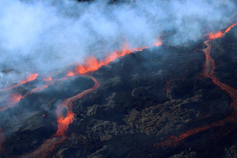 Steam and lava at the Piton de la Fournaise on the Indian Ocean island of Reunion, which erupted overnight. Richard Bouhet / AFP