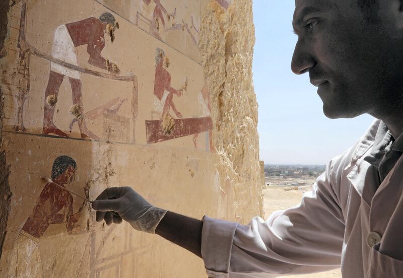 An Egyptian archaeologist works inside one of the largest newly discovered pharaonic tombs "Shedsu Djehuty" in Luxor, Egypt April 18, 2019. REUTERS/Mohamed Abd El Ghany