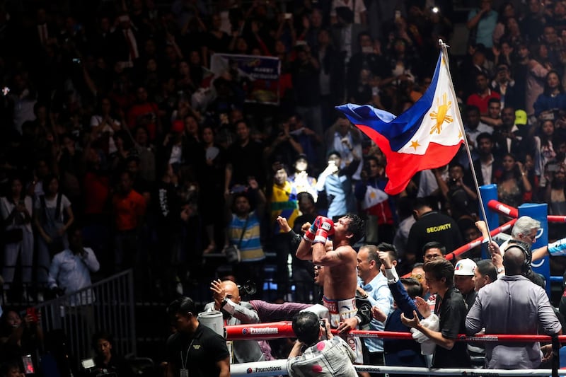 Manny Pacquiao celebrates after defeating Lucas Matthysse. EPA