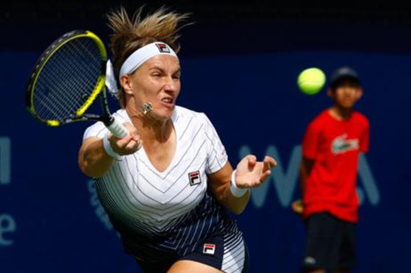 Svetlana Kuznetsova stretches to return a volley from Francesca Schiavone at the Dubai Duty Free Championships yesterday.