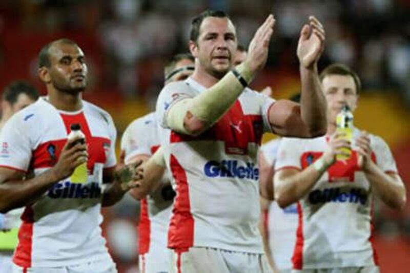 The England players applaud their travelling support who have backed them throughout what has been a disappointing Rugby League World Cup campaign.