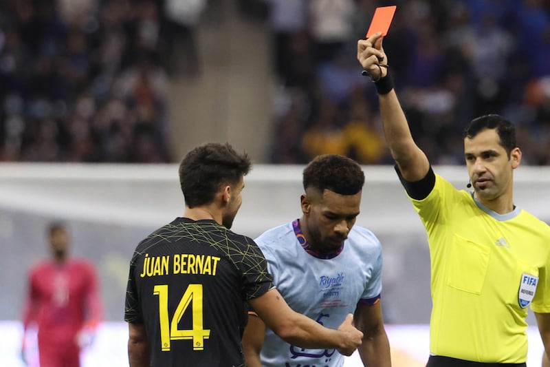 PSG defender Juan Bernat is shown the red card by Qatari referee Abdulrahman al-Jassim. AFP