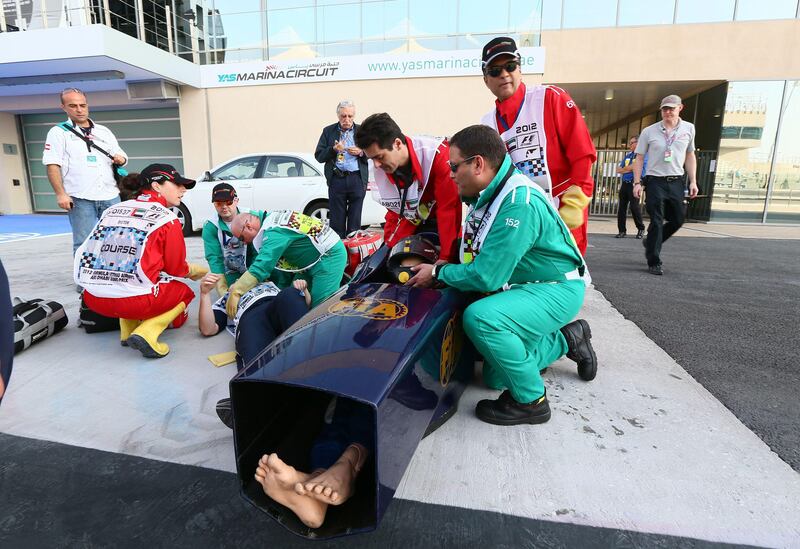 Emergency crews perform a mock rescue at the Yas Marina circuit on November 1, 2012 in Abu Dhabi during  the Abu Dhabi Formula One Grand Prix.  AFP PHOTO / MARWAN NAAMANI
 *** Local Caption ***  799319-01-08.jpg