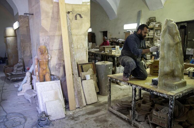 An artist works at the Replica Production Unit located at Salah Al Din Citadel in Cairo, Egypt.  EPA