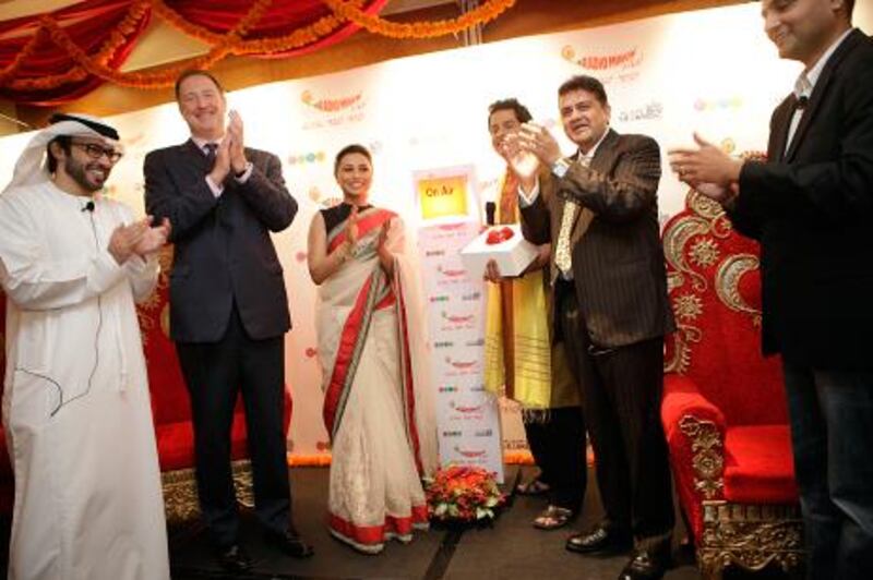 Abdul Rahman Awadh Al Harthi, Director of the Abu Dhabi Radio Network, left, Malcolm Wall CEO of Abu Dhabi Media Bollywood star Rani Mukherjee, host Shardul, Prashant Panday, CEO of Entertainment Network (india) and Sandi Sup Radio Director of Radio Mirchi. Sammy Dallal / The National