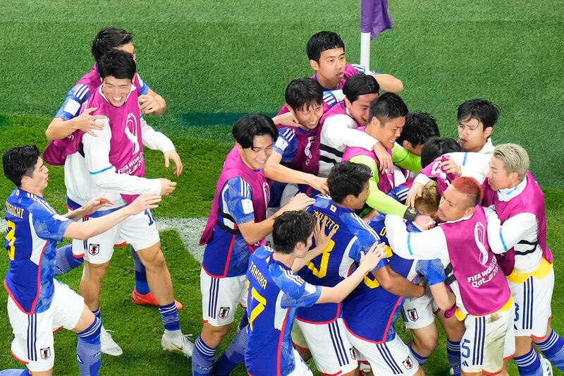 Japan celebrate after Ritsu Doan levelled the scores at 1-1. AP