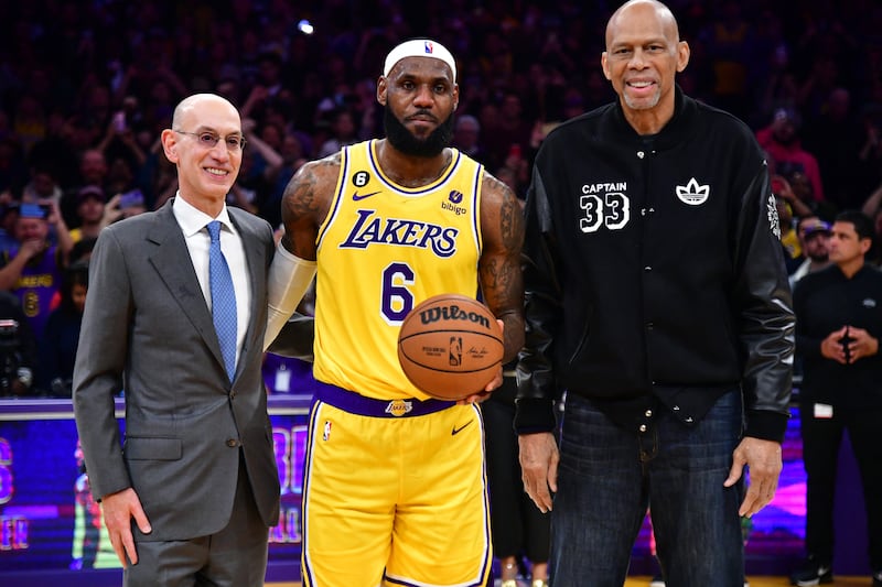Los Angeles Lakers forward LeBron James with NBA commissioner Adam Silver and the great Kareem Abdul-Jabbar after breaking NBA's all-time scoring record against the Oklahoma City Thunder at Crypto.com Arena. USA TODAY Sports