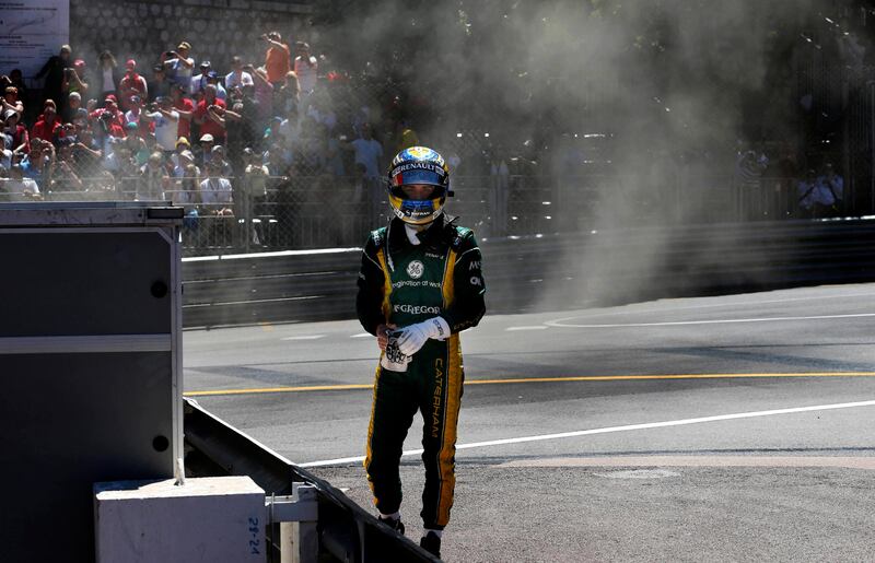 Caterham driver Charles Pic of France leaves his car after failing to complete the Formula One Grand Prix at the Monaco racetrack, in Monaco, Sunday, May 26, 2013. (AP Photo/Luca Bruno) *** Local Caption ***  Monaco F1 GP Auto Racing.JPEG-05ceb.jpg