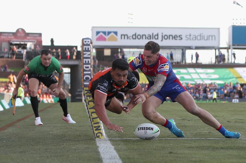 Wests Tigers' David Nofoaluma scores a try in the NRL match against Newcastle Knights at the McDonald Jones Stadium on Sunday, March 28. Getty