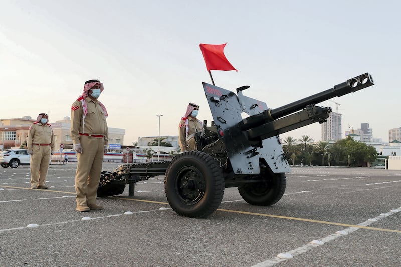 DUBAI, UNITED ARAB EMIRATES , April 24– 2020 :- Dubai Police officer getting ready to fire the cannon on the first day of Ramadan to break the fast at the Al Mankhool area in Dubai.  (Pawan Singh / The National) For News/Standalone/Online/Instagram. 