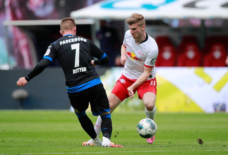 Timo Werner of RB Leipzig is tackled by Marlon Ritter SC Paderborn. Getty Images