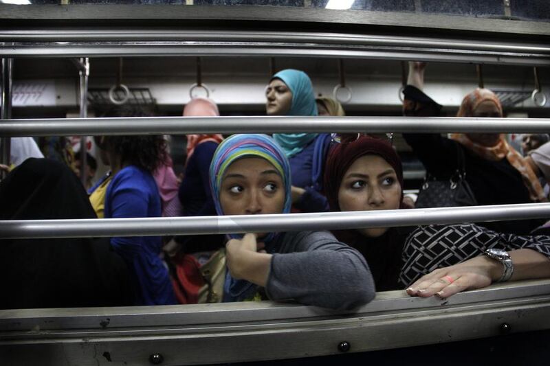Women look from an all-female car at Al Shohadaa (Martyrs) metro station.