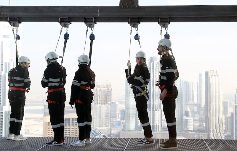 Jamie Goodwin, right, during the Sky Edge Walk. Pawan Singh / The National