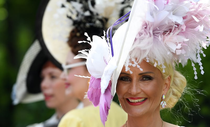 It's tradition for women to pull out all the stops with their headgear on Ladies' Day. EPA