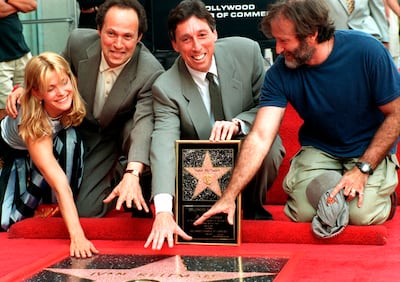 Ivan Reitman being honoured with a star on the the Hollywood Walk of Fame in 1997. Natasha Kinski, Billy Crystal and Robin Williams were at the event. AP