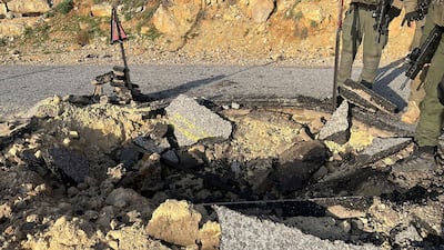 A cratered road at Hermon, near the occupied Golan Heights, following Iran's mass drone and missile attack. Reuters