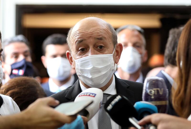 French Foreign Affair Minister Jean-Yves Le Drian wears a face mask to prevent the spread of the coronavirus disease (COVID-19) as he talks to the media at a school in Mechref, Lebanon July 24, 2020. REUTERS/Mohamed Azakir