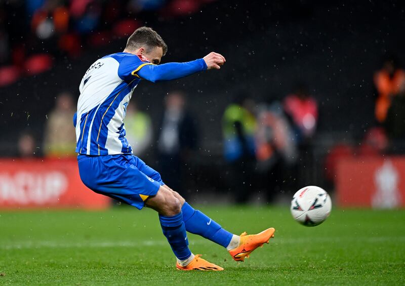 Brighton & Hove Albion's Solly March misses the decisive penalty in the shootout. Reuters