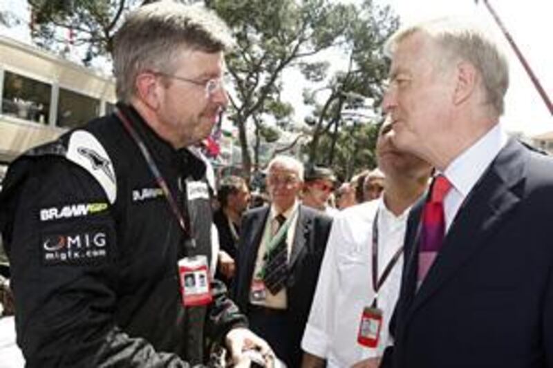 The FIA president Max Mosley, right, talks to Brawn GP team head Ross Brawn on the Monaco grid on Sunday. Mosley spent much of the weekend talking to team bosses over the sport's regulations row.