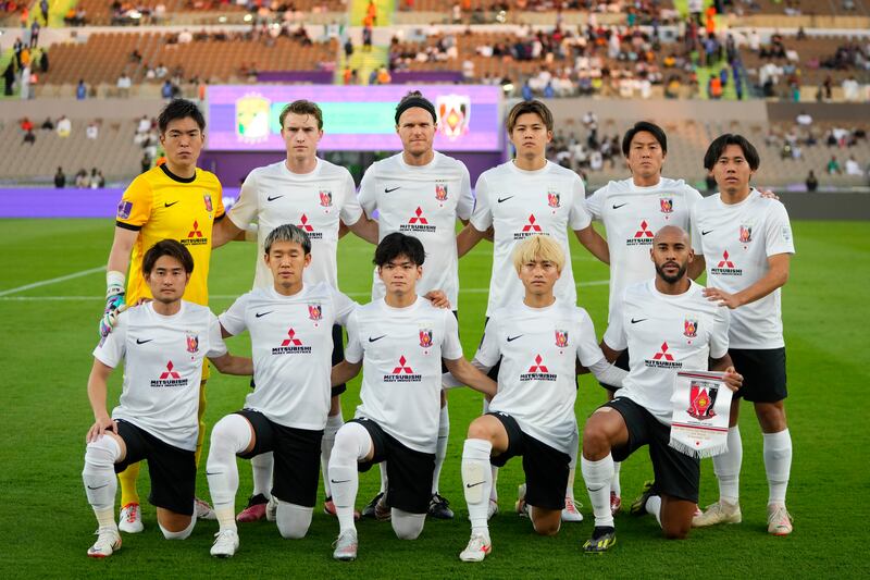 Urawa Reds' starting players pose for a team photo. AP
