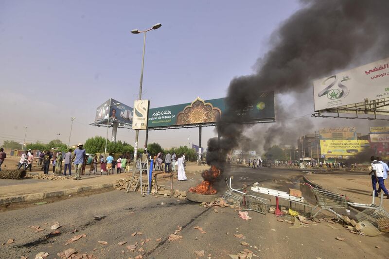 Sudanese protesters burn tyres and barricade the road in Khartoum's twin city of Omdurman.  AFP