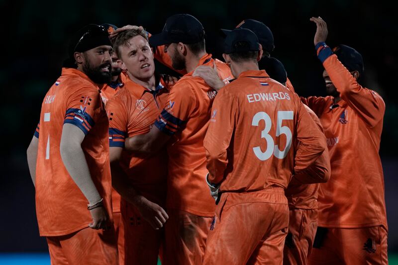 The Netherlands' players congratulate Logan van Beek, second left without cap, for taking the wicket of South Africa's David Miller during the ICC Men's Cricket World Cup match in Dharamshala on Tuesday, October 17, 2023. AP 