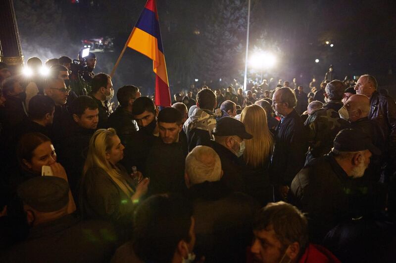 Protestors gather outside the Armenian parliament building after the announcement of a peace deal in the war between Armenia and Azerbaijan. Getty Images