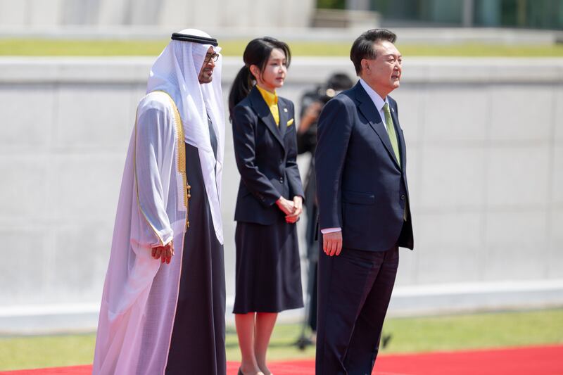 Sheikh Mohamed, Mr Yoon and the first lady. Abdulla Al Neyadi / UAE Presidential Court 