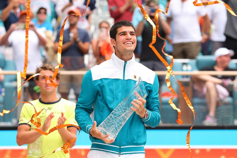 Carlos Alcaraz raises the Butch Buchholz Trophy after defeating Casper Ruud in the Miami Open final. Getty