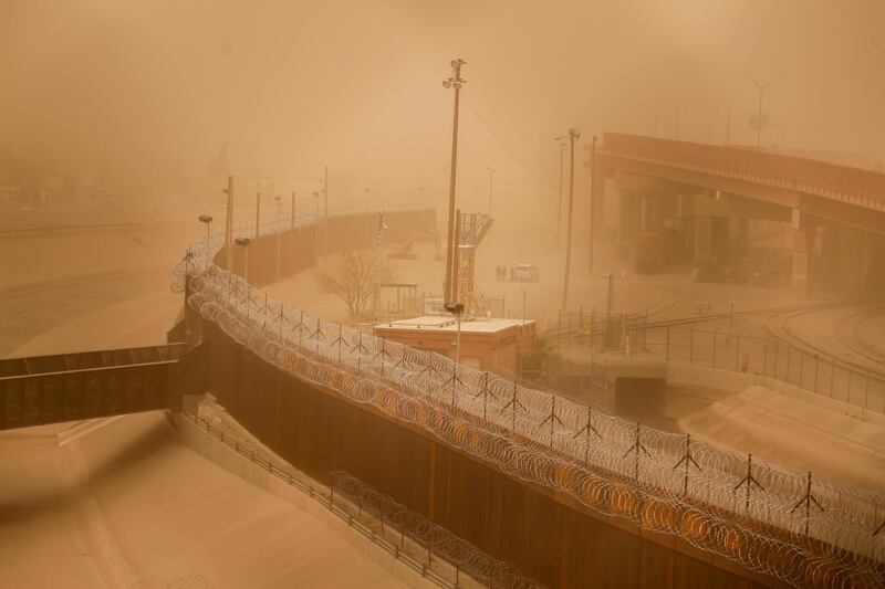A section of the border wall in El Paso, Texas, US, during a sandstorm, as seen from Ciudad Juarez, Mexico. Reuters