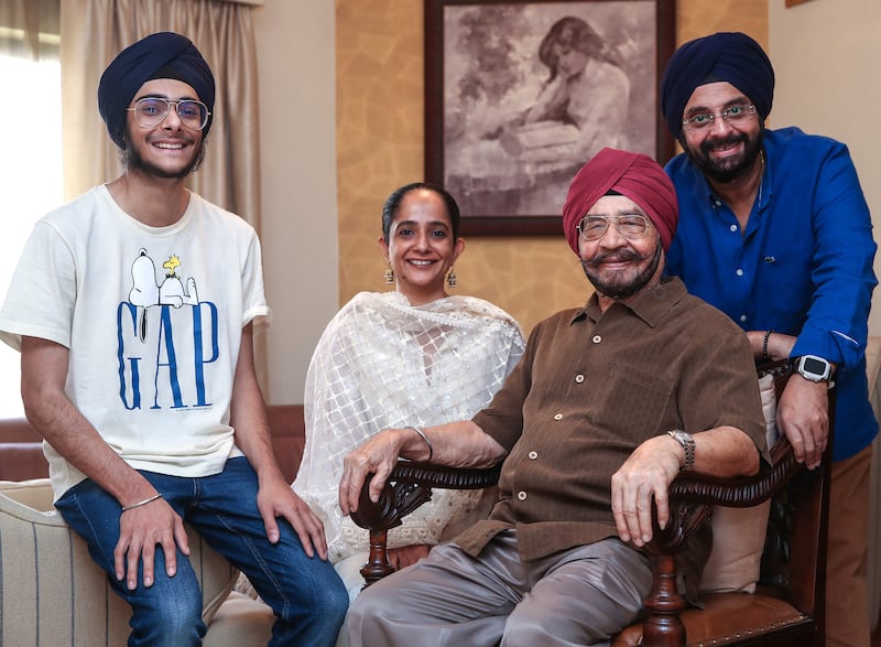 Three generations of Pujjis in Dubai: Narindra Singh Pujji with his grandson Kabir, left, daughter-in-law Ekta and son Mandeep. Victor Besa / The National