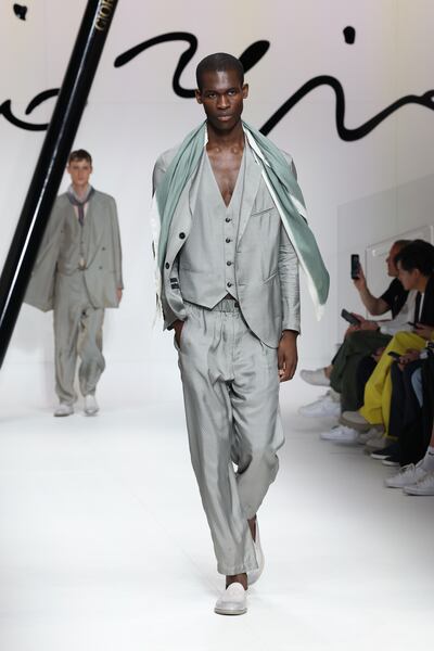 A grey silk three-piece suit by Giorgio Armani. Getty Images