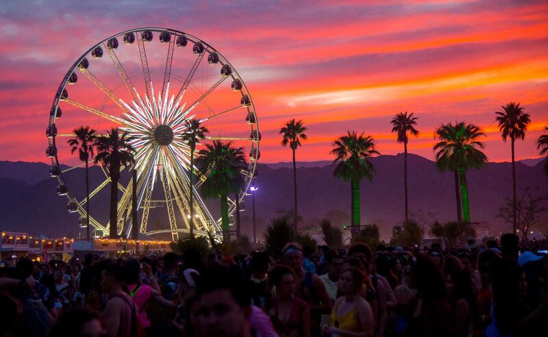 FILE - In this April 21, 2018 file photo, the sun sets over the Coachella Music & Arts Festival in Indio, Calif. The Coachella and Stagecoach music festivals have been canceled for 2020 due to coronavirus concerns. Riverside County's public health officer signed an order Wednesday, June 10, 2020, to cancel the popular festivals this year outside Palm Springs, Calif. (Photo by Amy Harris/Invision/AP, File)