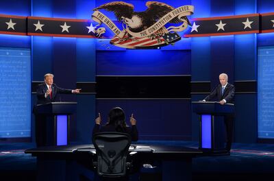 U.S. President Donald Trump speaks as Joe Biden, 2020 Democratic presidential nominee, right, listens during the U.S. presidential debate at Belmont University in Nashville, Tennessee, U.S., on Thursday, Oct. 22, 2020. Trump and Biden traded charges of secretly taking money from foreign interests, after the former vice president addressed head-on Trump’s efforts to portray him as corrupt. Photographer: Kevin Dietsch/UPI/Bloomberg