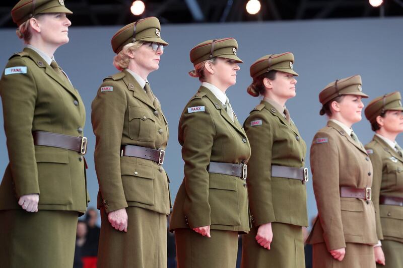 Performers dressed as female soldiers take part in an event to commemorate the 75th anniversary of the D-Day landings, in Portsmouth, southern England.  AFP