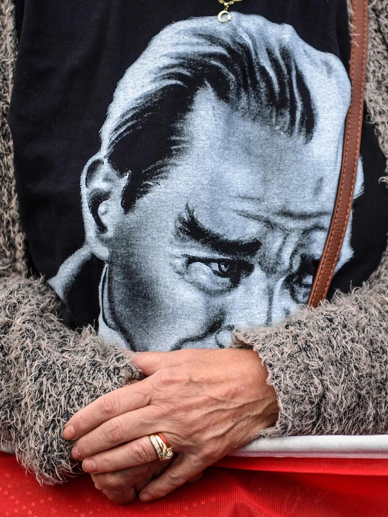 A woman in Istanbul wears a t-shirt with a portrait of Mustafa Kemal Ataturk, founder of modern Turkey, who died on November 10, 1938. Ozan Kose / AFP Photo