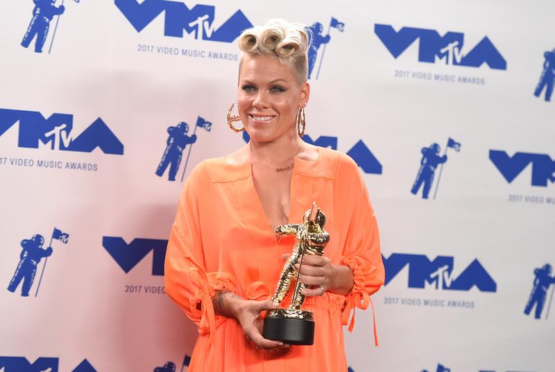 Pink poses in the press room with the MTV Michael Jackson Video Vanguard Award. Jordan Strauss / Invision / AP