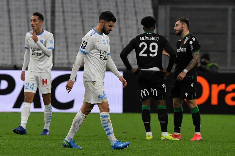 Dejected Marseille midfielder Morgan Sanson, centre, at the end of the game.