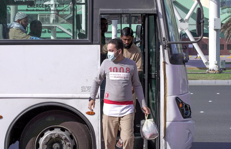 Abu Dhabi, United Arab Emirates, March 5, 2020.  A worker with a face mask disembarks from a bus at the Abu Dhabi Main Bus Terminal area.   
FOR:  standalone
Victor Besa / The National
Section:  NA