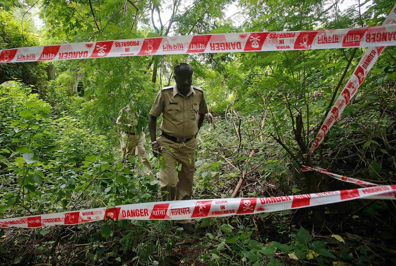 Policemen survey the crime scene where a photo journalist was raped inside an abandoned textile mill in Mumbai August 23, 2013. A photo journalist in her early 20s was gang-raped in the Indian city of Mumbai, police said on Friday, evoking comparisons to a similar assault in New Delhi in December that led to nationwide protests and a revision of the country's rape laws. REUTERS/Danish Siddiqui (INDIA - Tags: CRIME LAW) *** Local Caption ***  MUM100_INDIA-RAPE-_0823_11.JPG