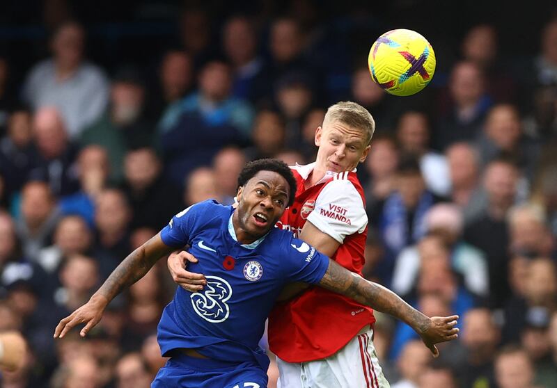 Chelsea's Raheem Sterling battles for the ball with Arsenal left-back Oleksandr Zinchenko. Reuters