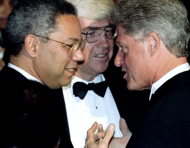 President Bill Clinton talks to Powell and former housing secretary Jack Kemp in September 1995 in Washington. Reuters