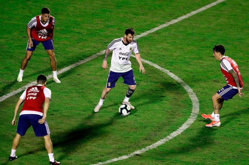 Messi finds himself under pressure with the ball during training. AFP